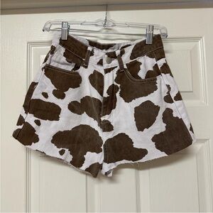 Brown and white cow print denim shorts